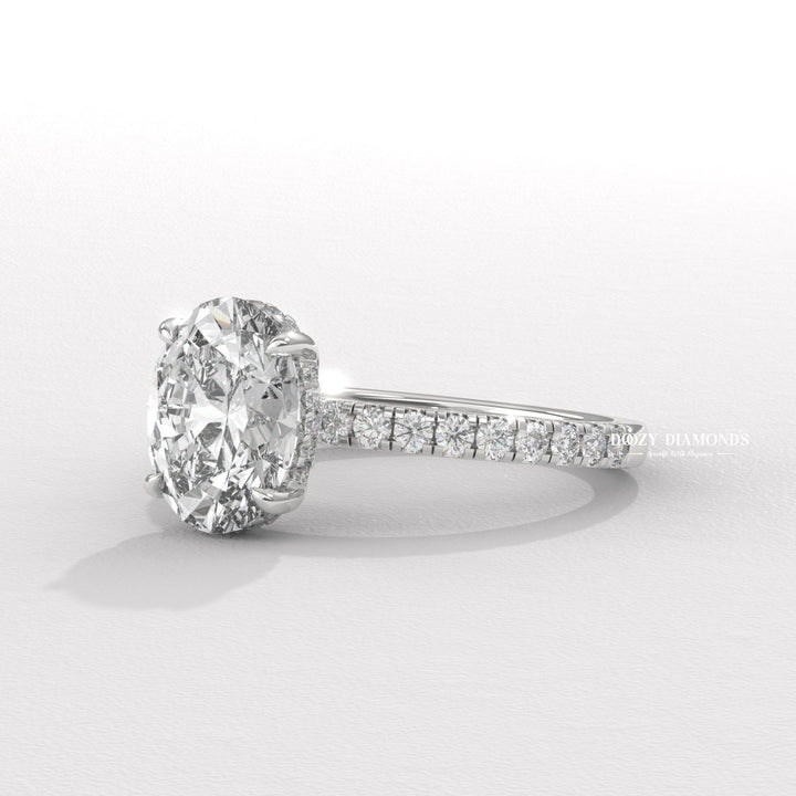Profile view of oval cut hidden halo engagement ring band