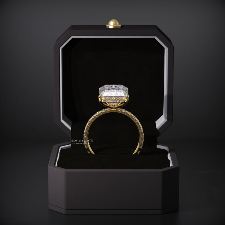 Radiant hidden halo engagement ring offered in gold and platinum