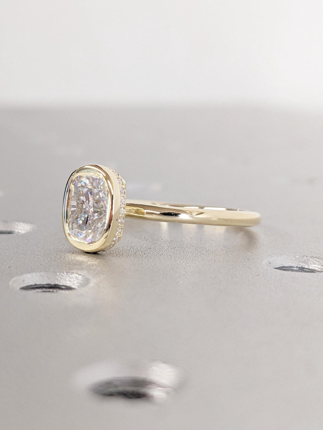 Cushion hidden halo engagement ring close-up showing high clarity diamond clarity