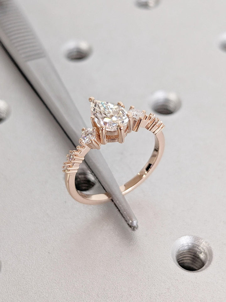 Handcrafted pear cut cluster lab grown diamond engagement ring