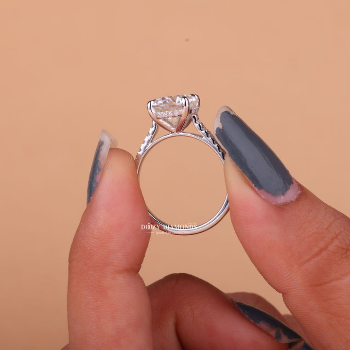 Round hidden halo lab grown diamond ring fitted on finger