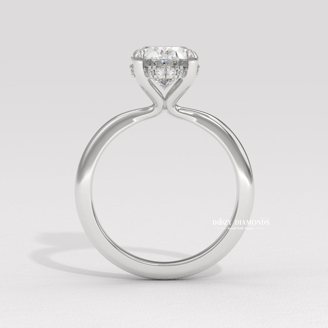 Oval cut solitaire engagement ring with IGI certified center diamond