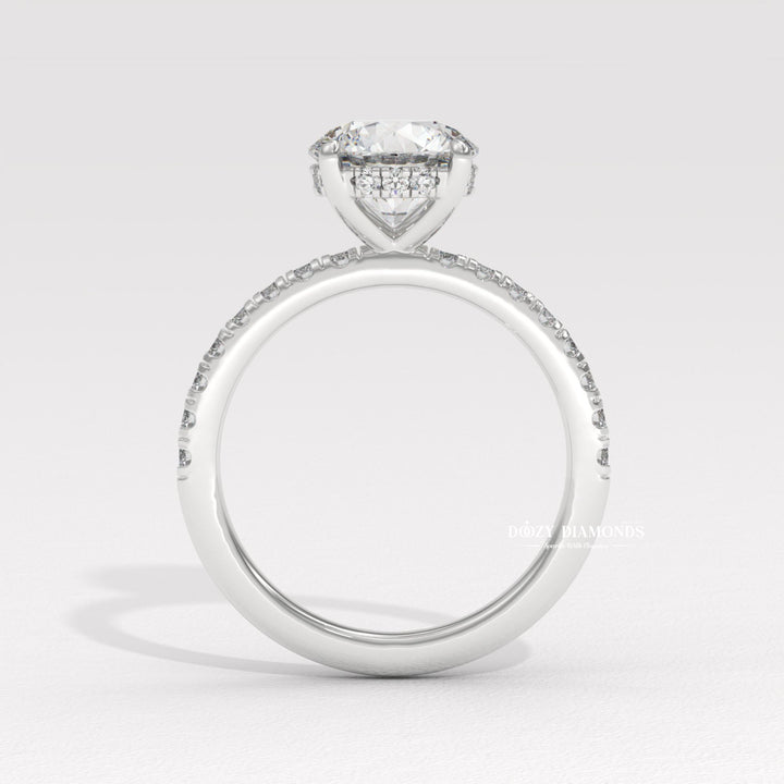 Round pave engagement ring offered in gold and platinum