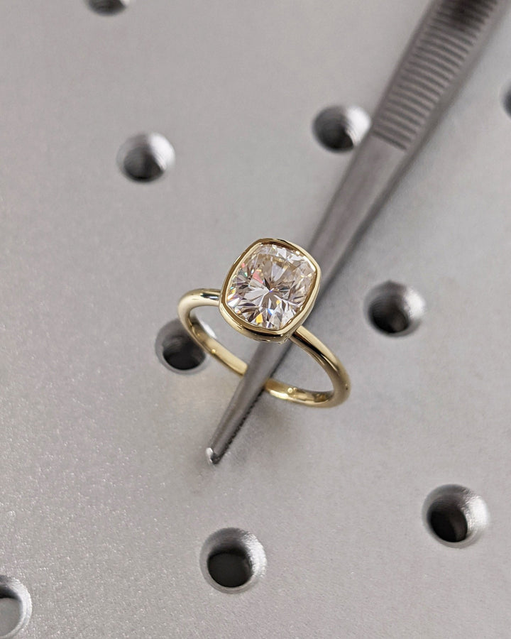 Cushion bezel engagement ring viewed from the side