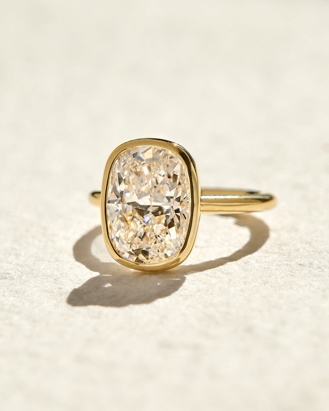 Cushion cut diamond ring worn on hand