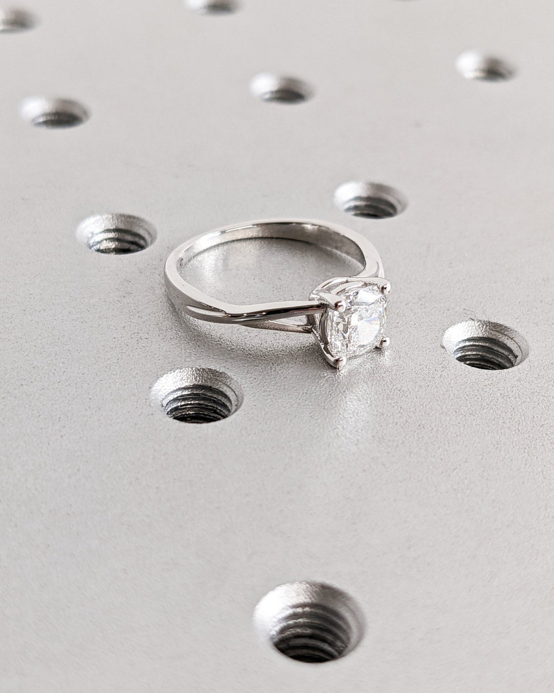 Cushion cut split shank engagement ring with IGI certified center diamond