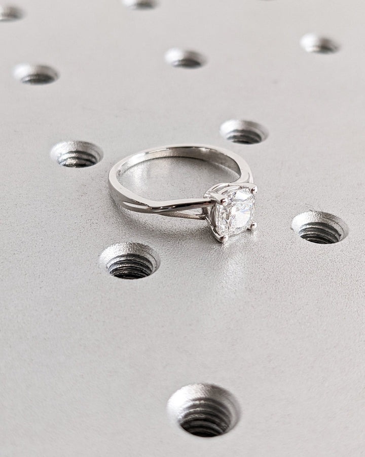 Cushion cut split shank engagement ring with IGI certified center diamond