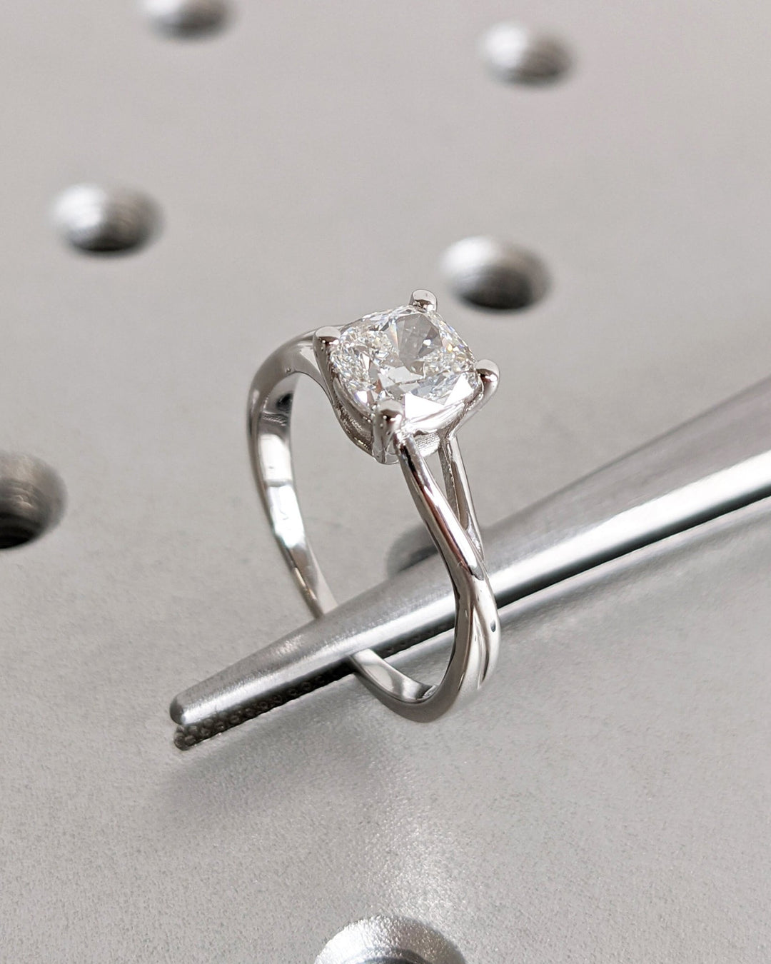 IGI certified cushion cut diamond in split shank engagement ring setting