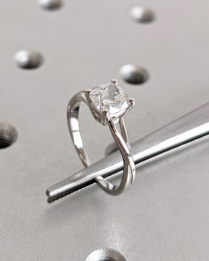 IGI certified cushion cut diamond in split shank engagement ring setting