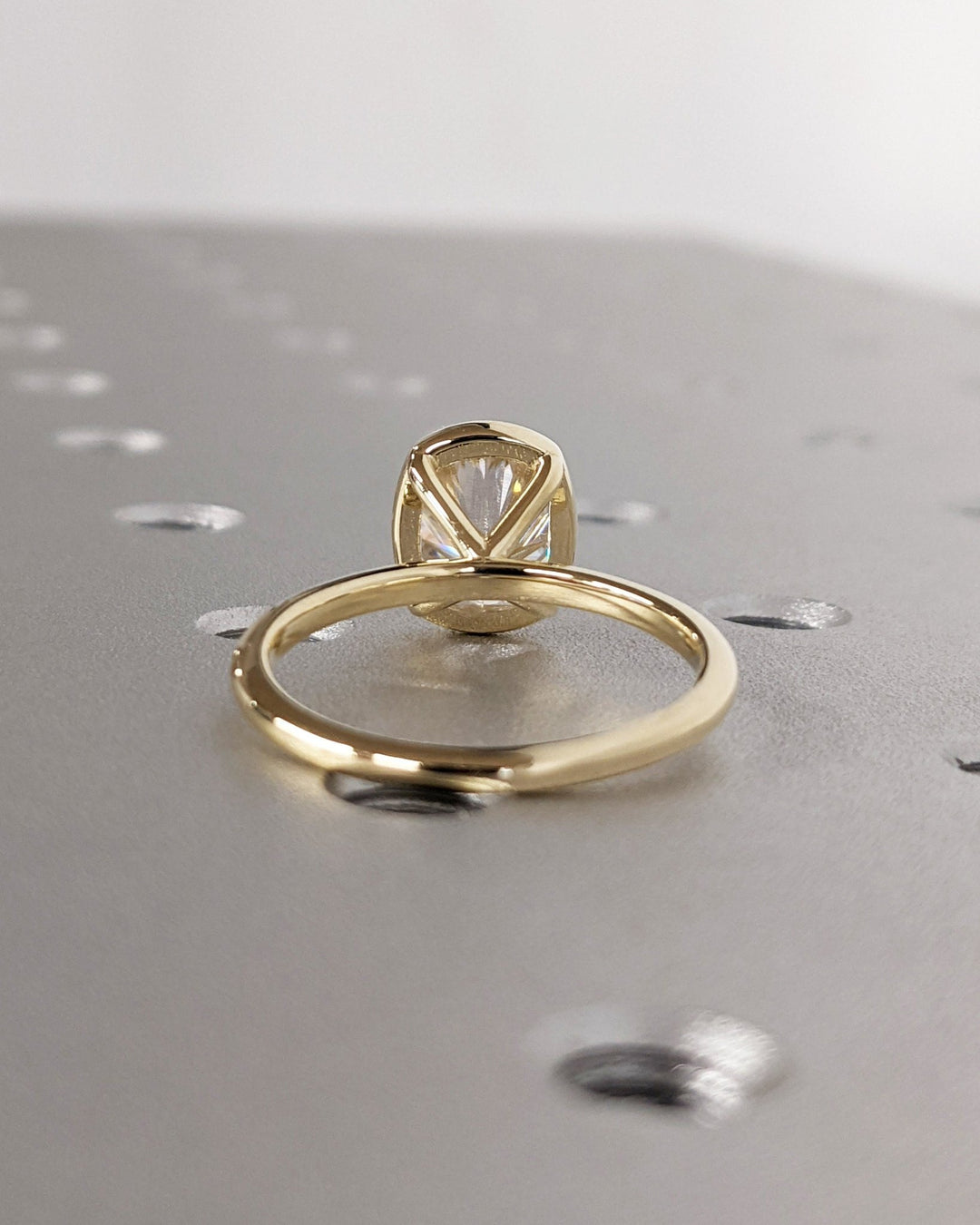 Cushion cut engagement ring side view showing band detail
