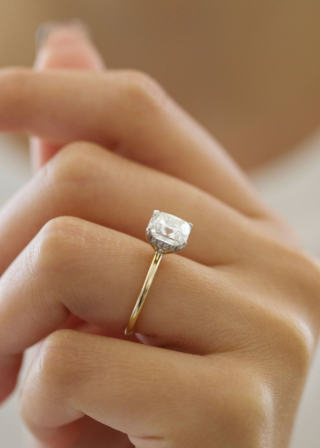 Cushion cut hidden halo engagement ring with IGI certified center diamond