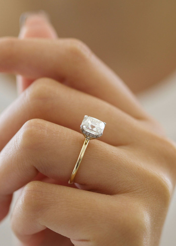 Cushion cut hidden halo engagement ring with IGI certified center diamond
