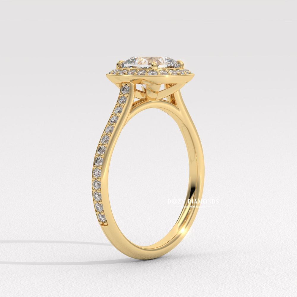 Close-up of cushion cut center diamond in halo engagement ring