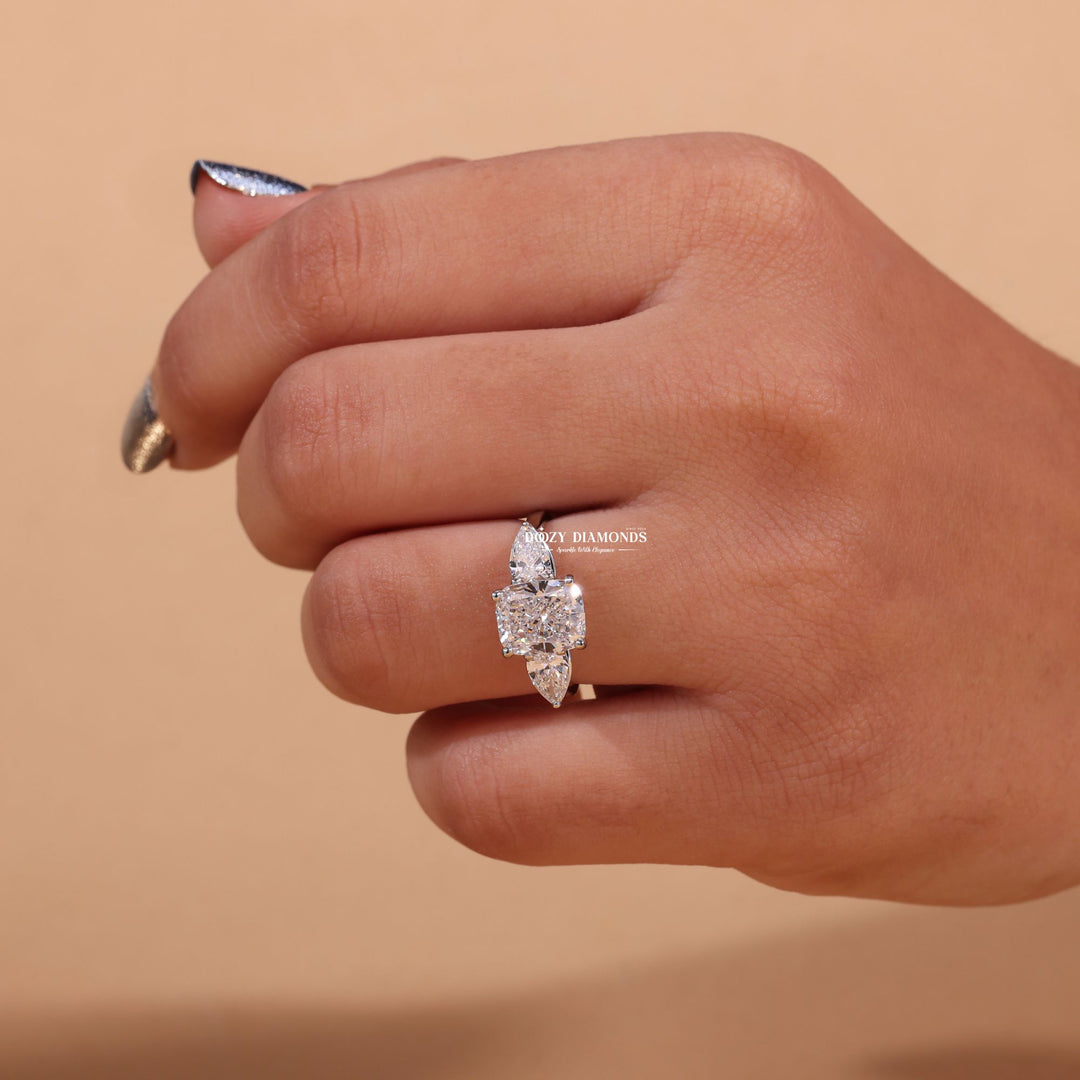 Cushion three stone lab grown diamond ring fitted on finger