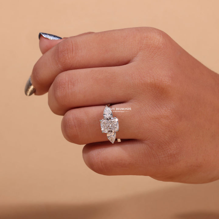 Cushion three stone lab grown diamond ring fitted on finger