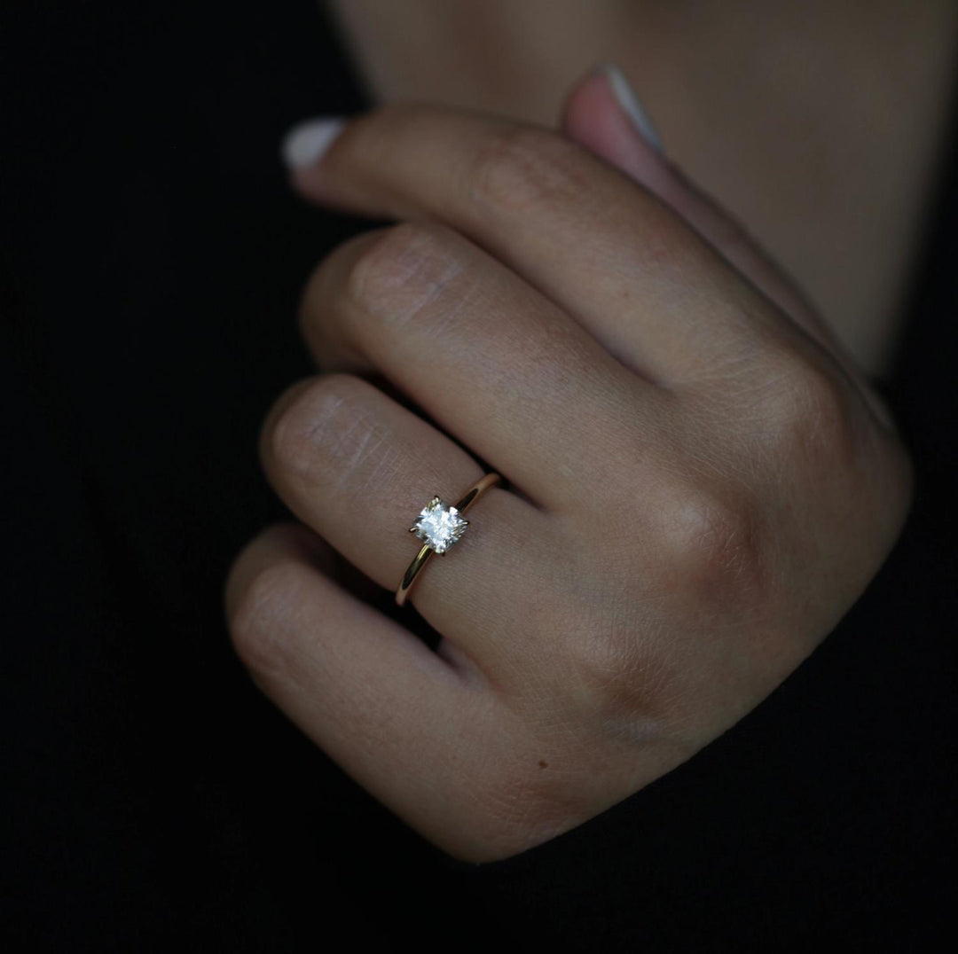 Cushion solitaire diamond ring presented in signature gift packaging