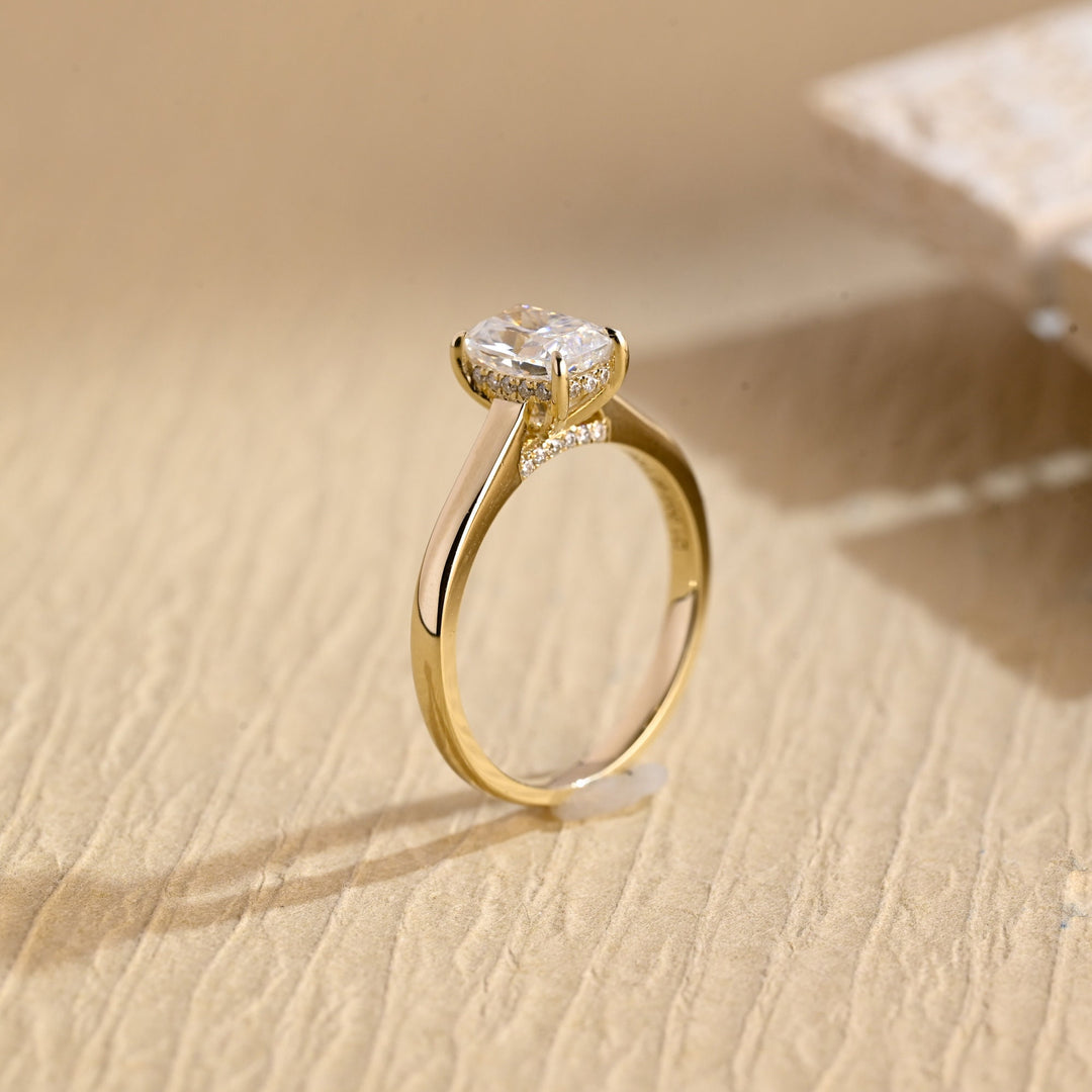 Lifestyle shot of cushion hidden halo diamond ring on hand
