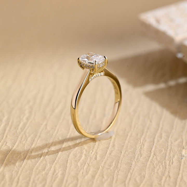 Lifestyle shot of cushion hidden halo diamond ring on hand