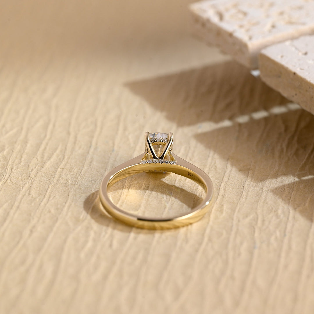 Cushion cut diamond ring worn on hand