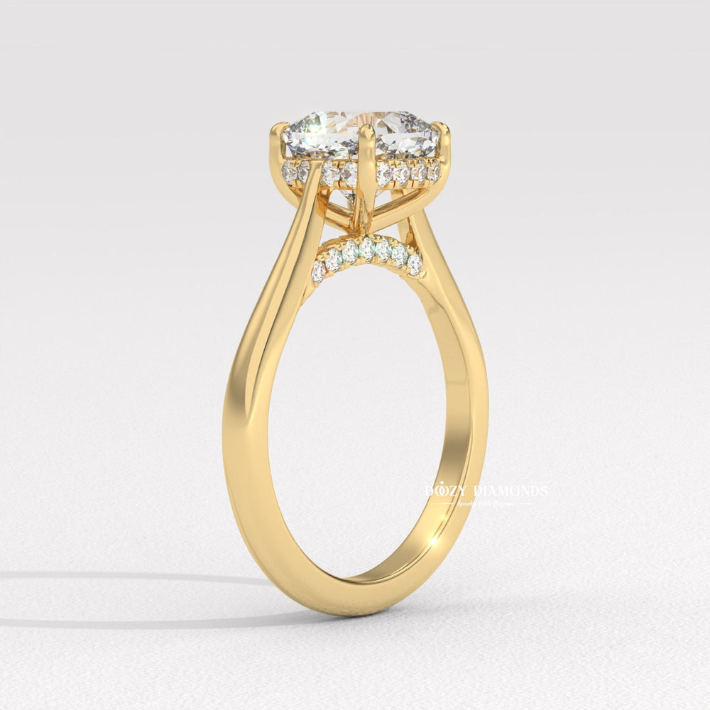 Cushion solitaire engagement ring shown on hand for true-to-life sizing