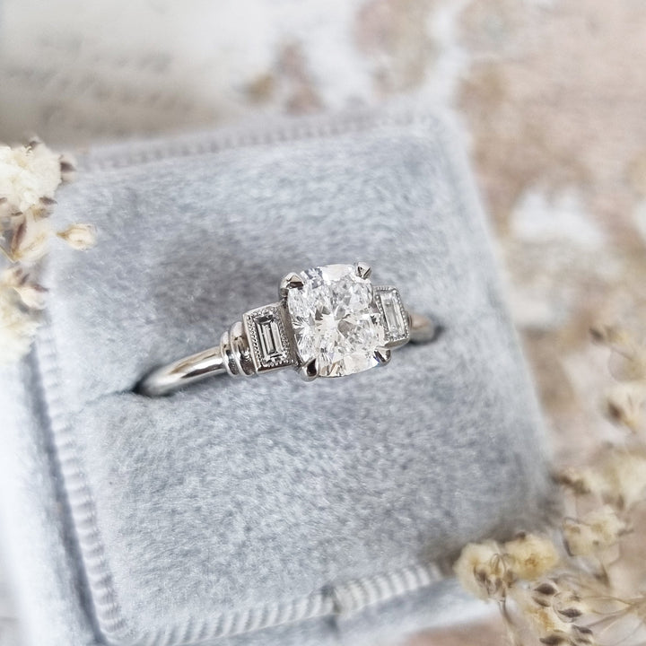 Cushion three stone lab grown diamond ring fitted on finger