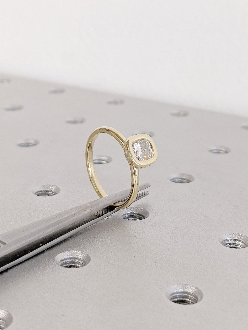 Top-down view of cushion cut hidden halo engagement ring