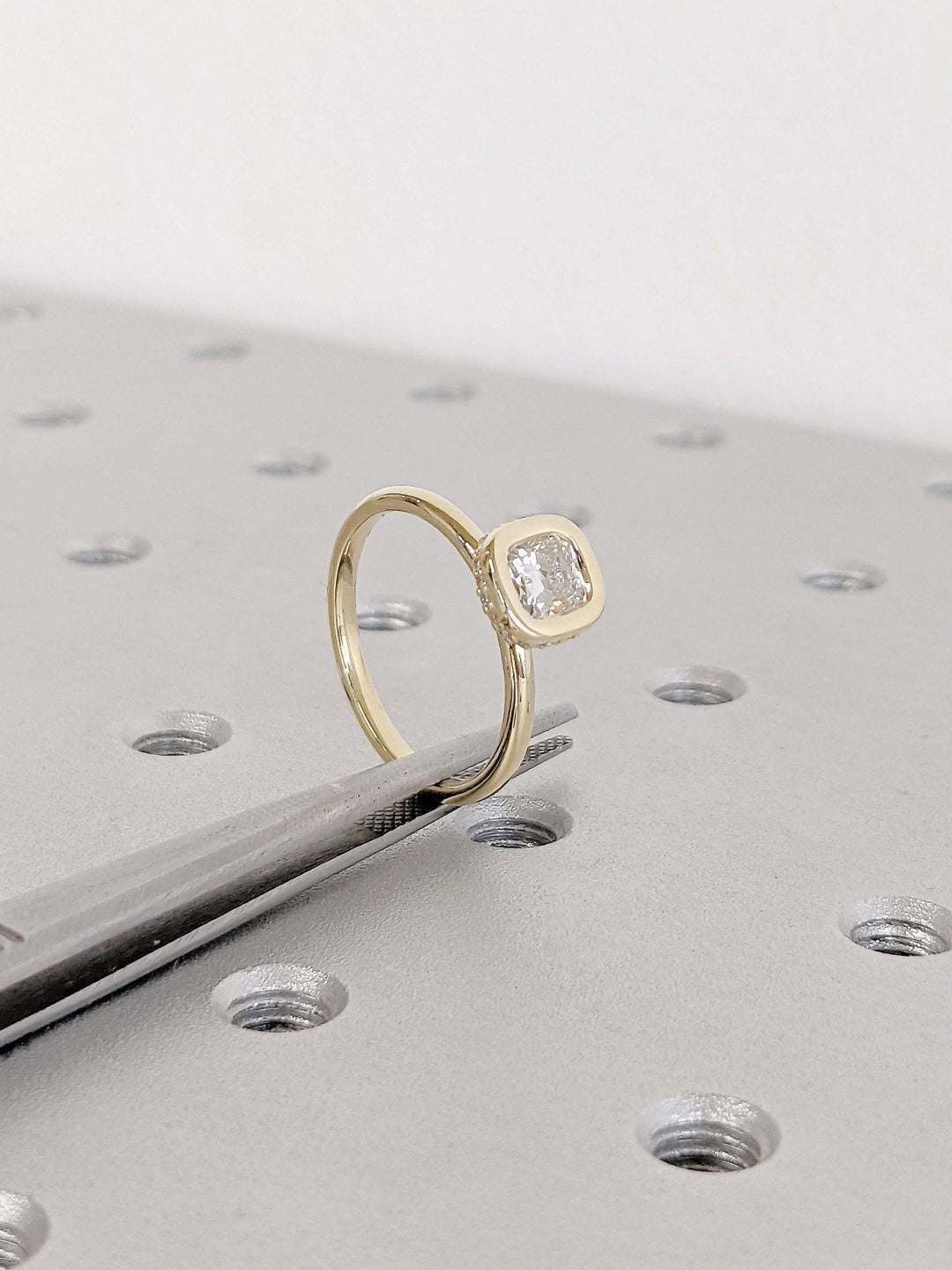 Top-down view of cushion cut hidden halo engagement ring