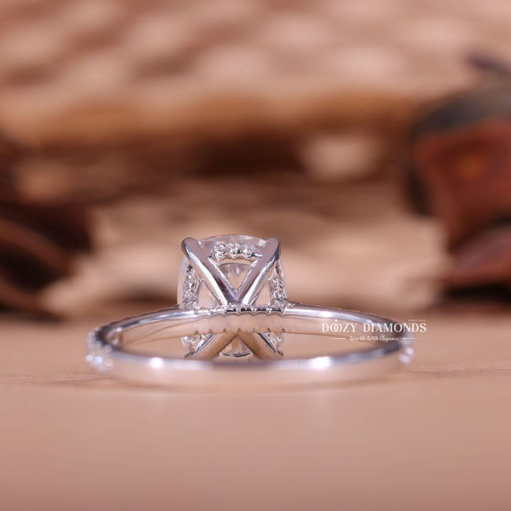 Cushion cut engagement ring shown with authenticity certificate
