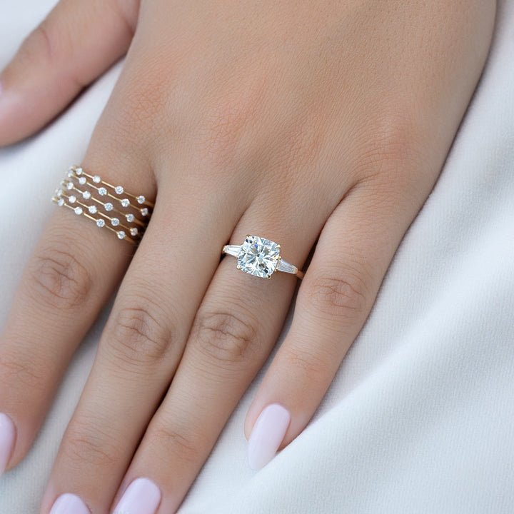 Cushion three stone diamond engagement ring available in multiple metals