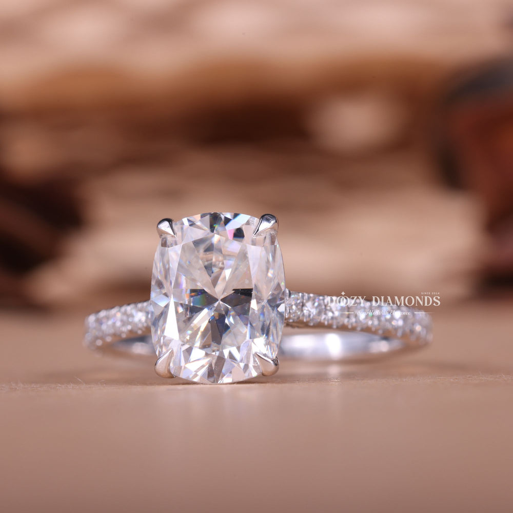 Cushion hidden halo diamond ring presented in signature gift packaging