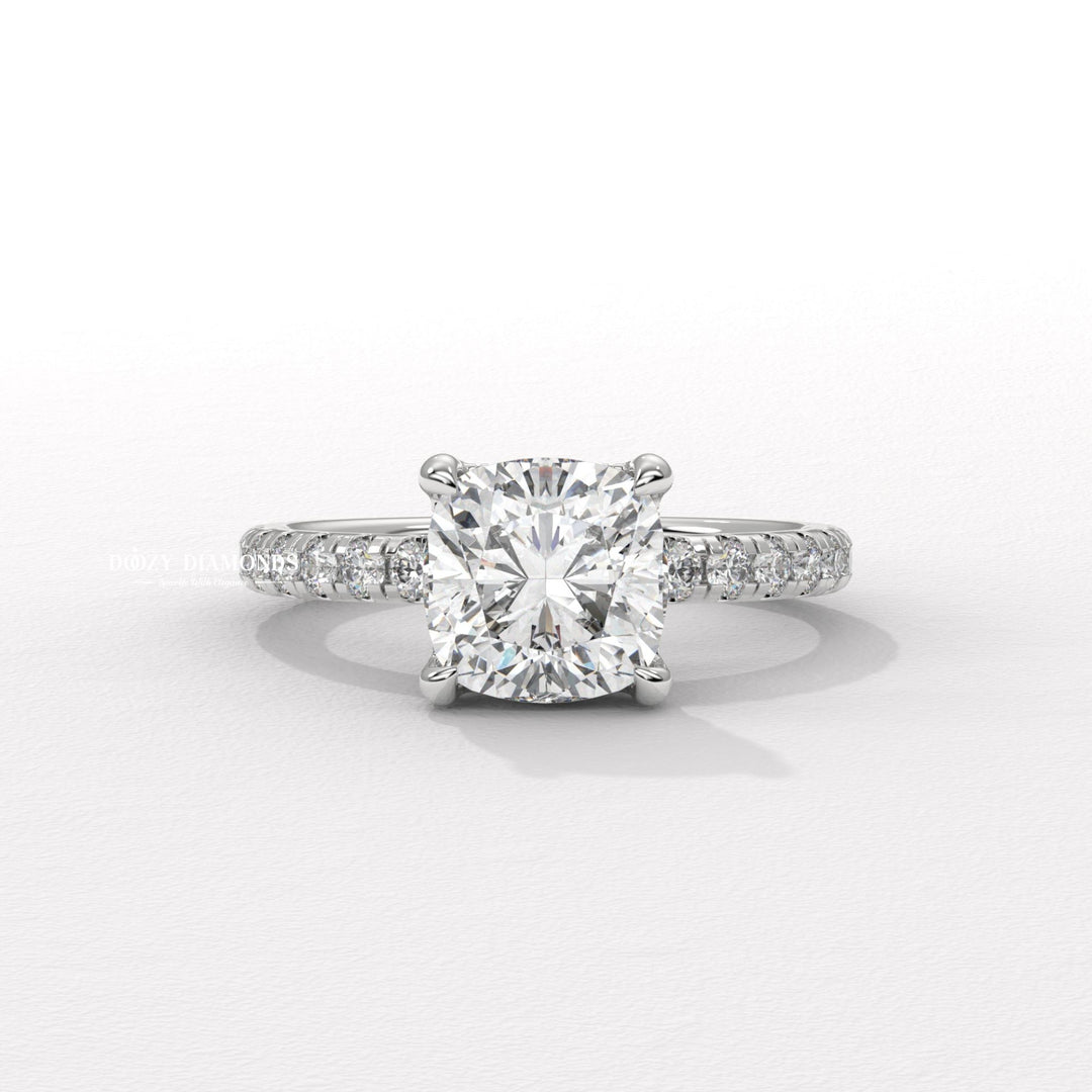 Cushion solitaire engagement ring photographed in natural light