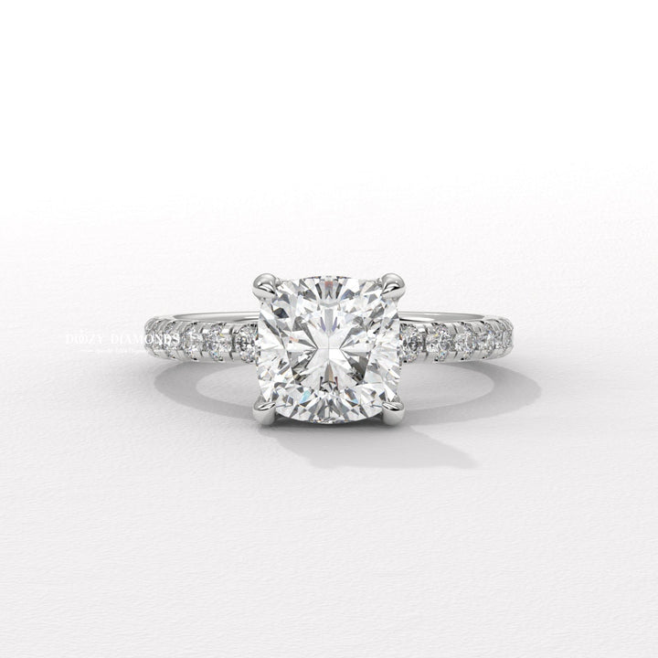 Cushion solitaire engagement ring photographed in natural light