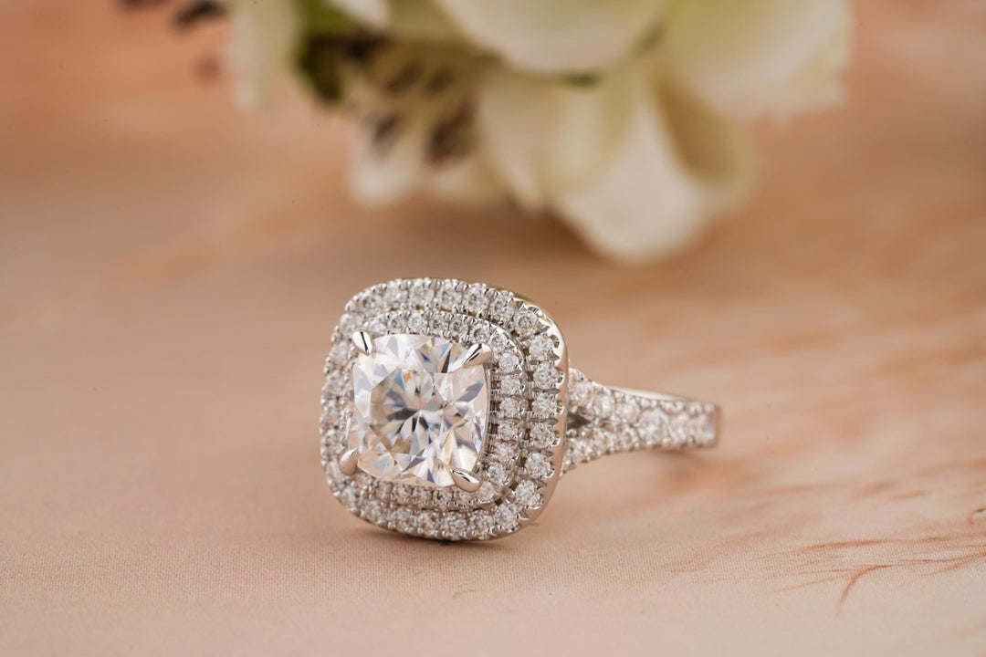 Cushion cut engagement ring shown with authenticity certificate
