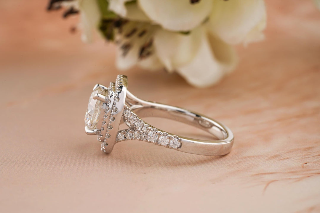 Cushion halo engagement ring offered in gold and platinum