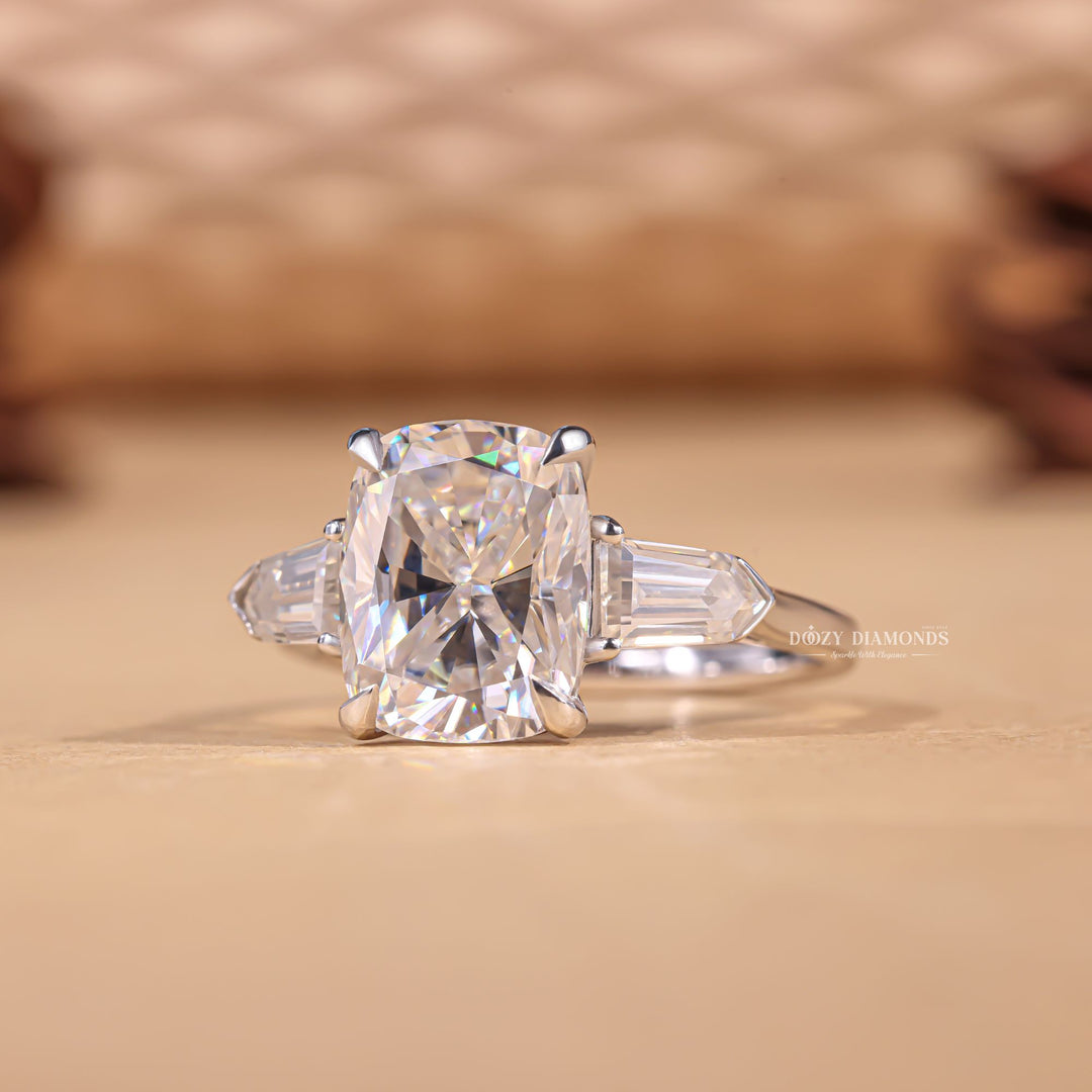 Macro shot of cushion cut diamond facets in three stone ring setting
