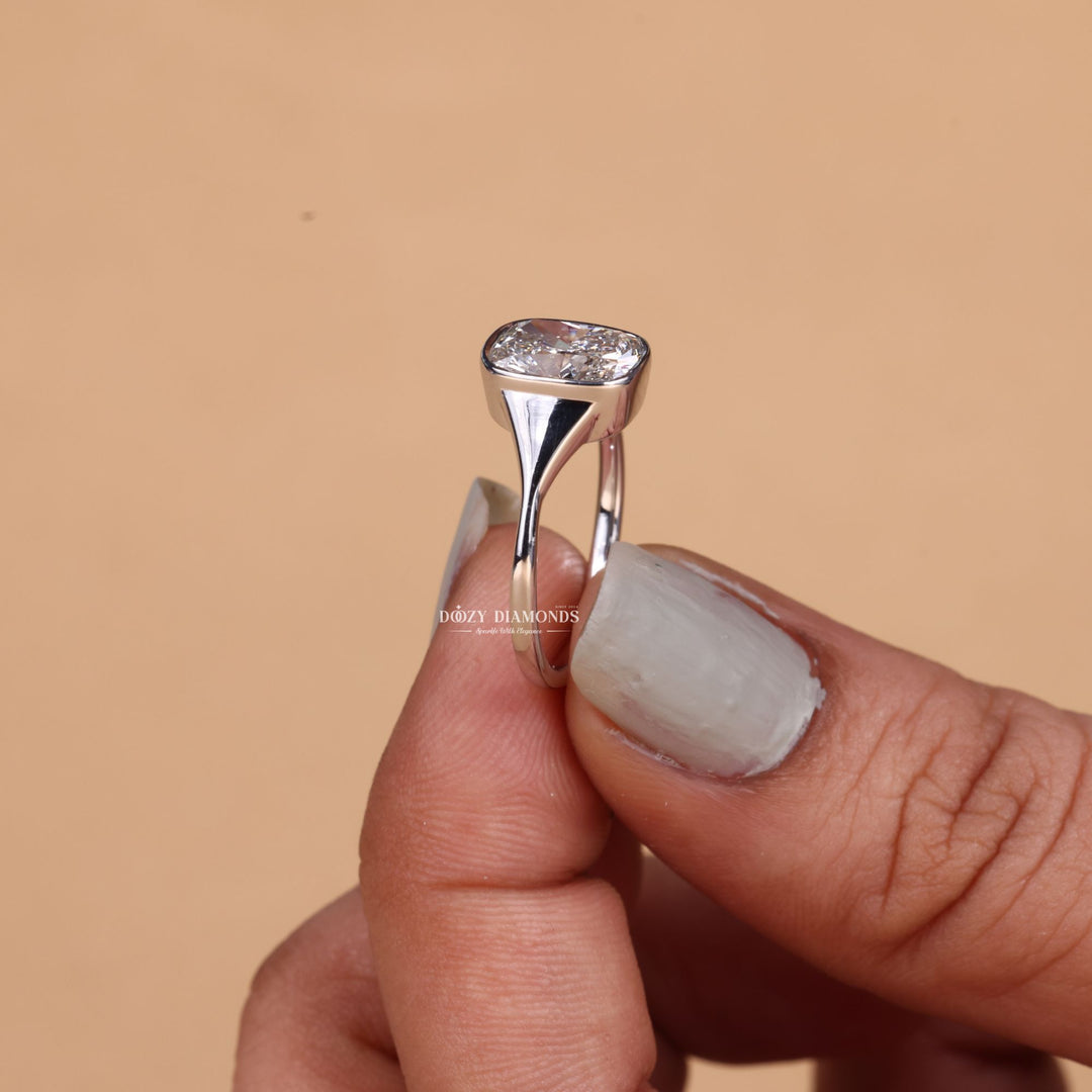 Cushion bezel lab grown diamond ring fitted on finger