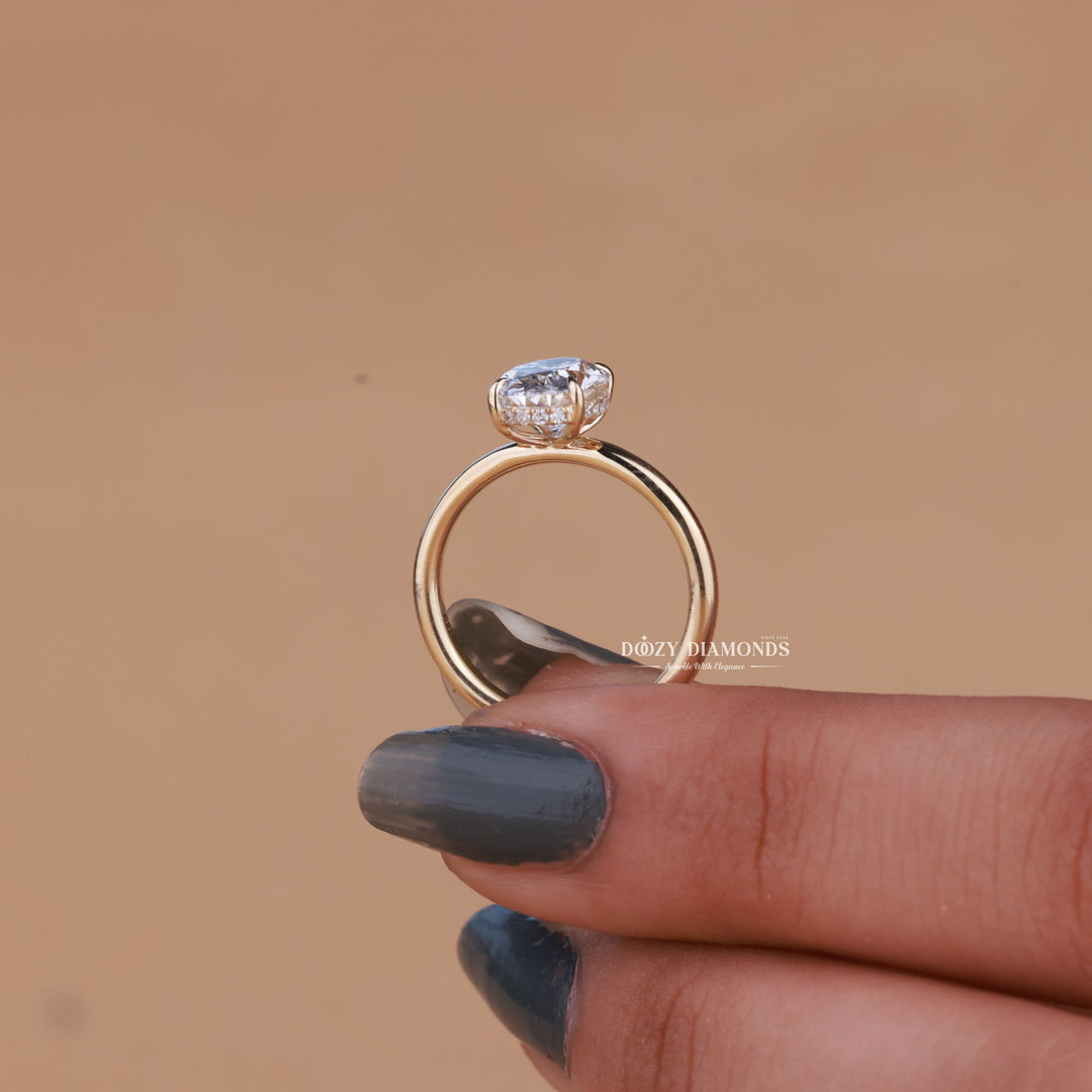 Unboxing view of oval cut hidden halo diamond engagement ring