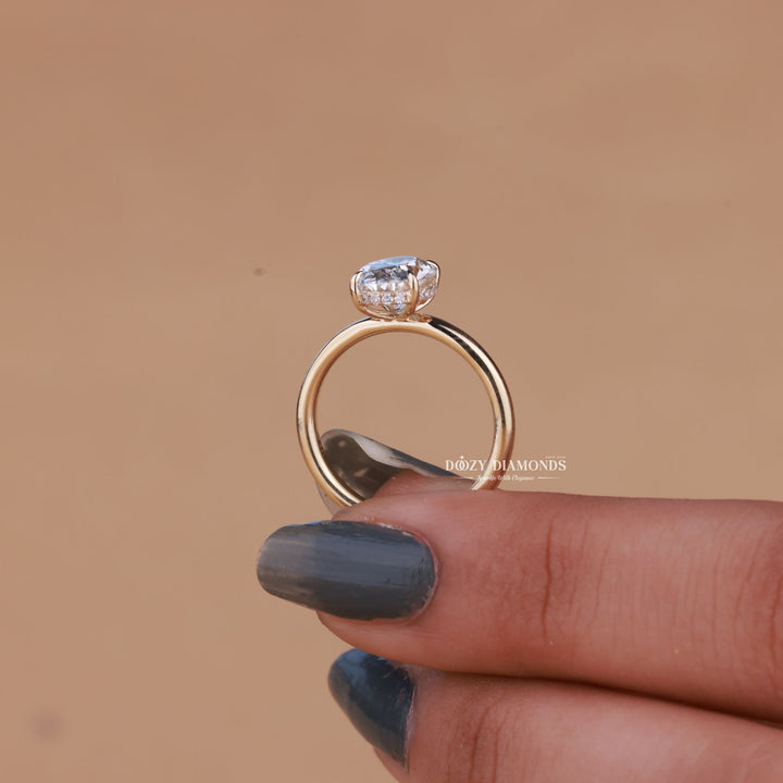 Unboxing view of oval cut hidden halo diamond engagement ring