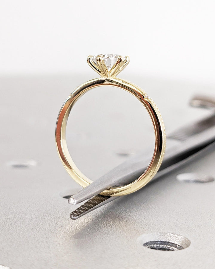 Marquise cut solitaire engagement ring with IGI certified center diamond