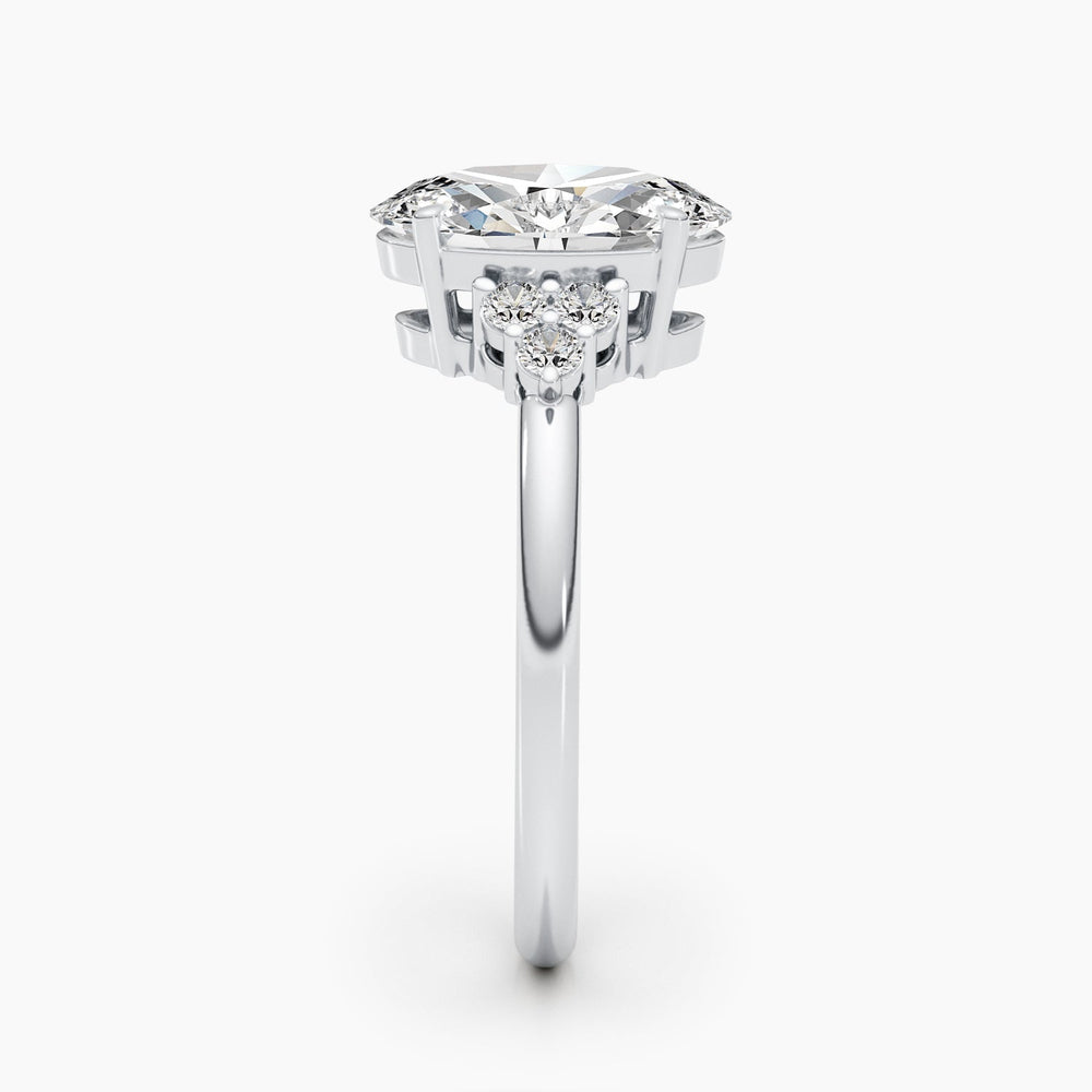 Oval cluster engagement ring close-up highlighting diamond sparkle