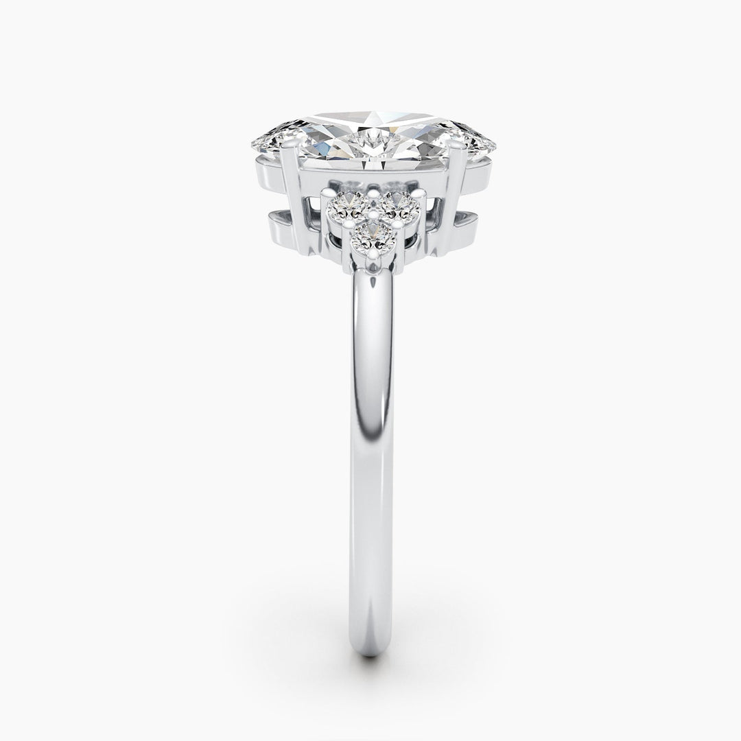Oval cluster engagement ring close-up highlighting diamond sparkle