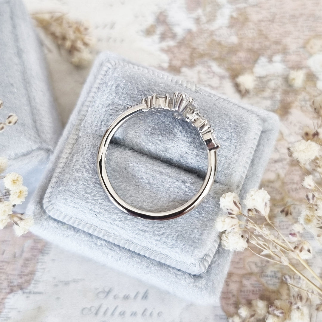 Fine craftsmanship detail on pear cluster engagement ring