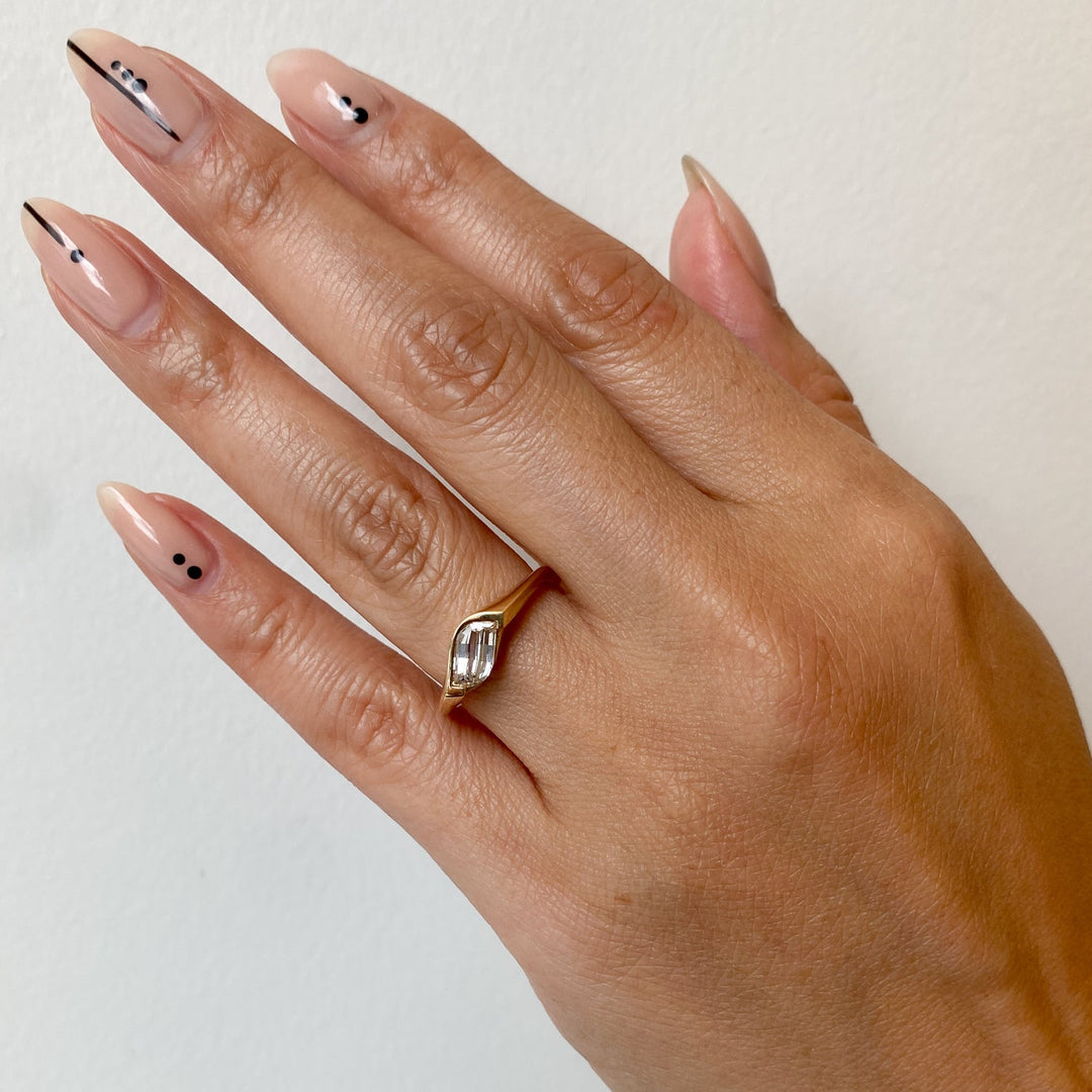 Flame-cut solitaire engagement ring with certified lab grown diamond
