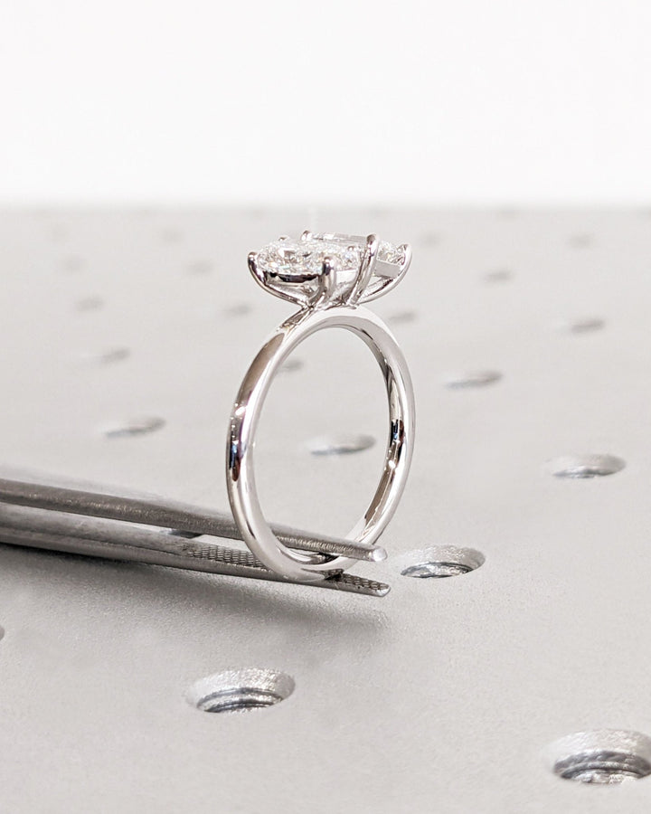 Close-up of pear cut center diamond in solitaire engagement ring