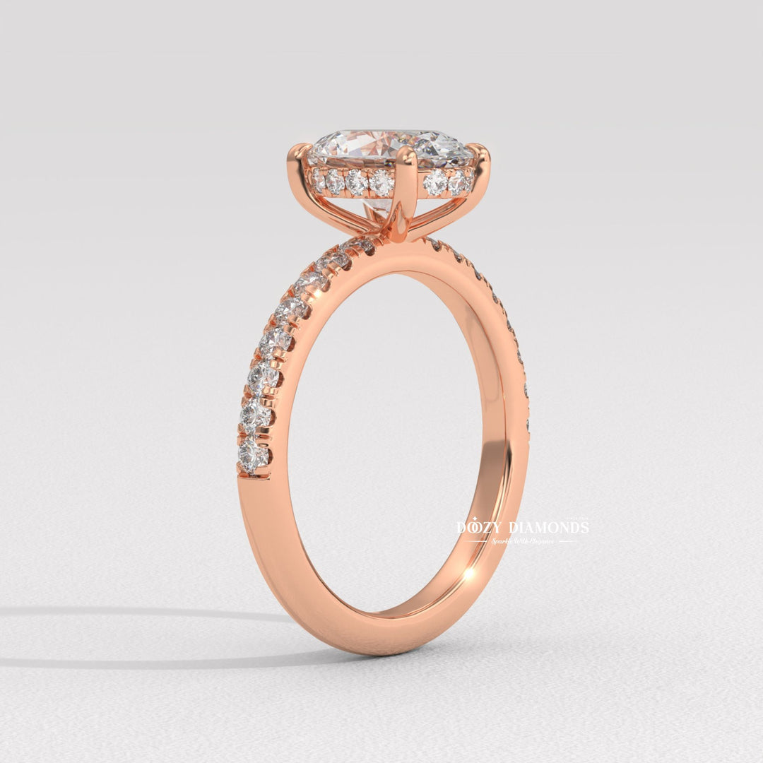 Close-up of oval cut center diamond in hidden halo engagement ring