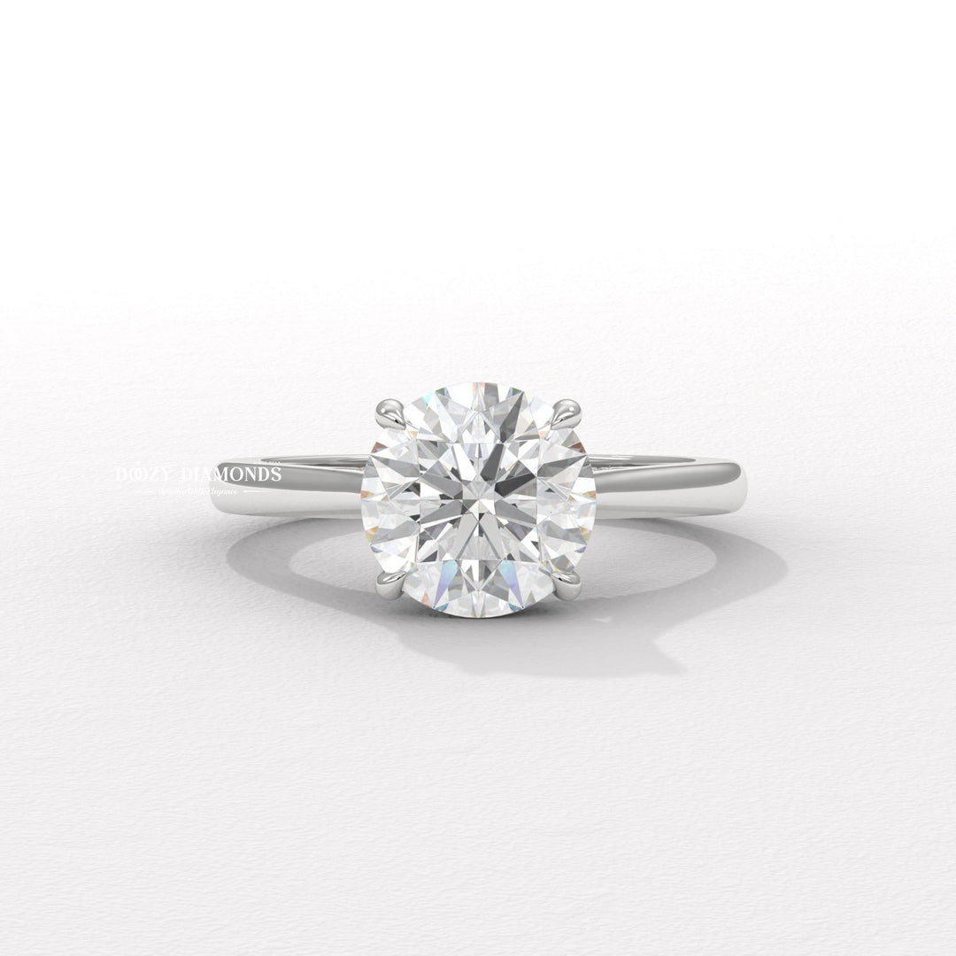 Detailed close-up of round hidden halo diamond engagement ring
