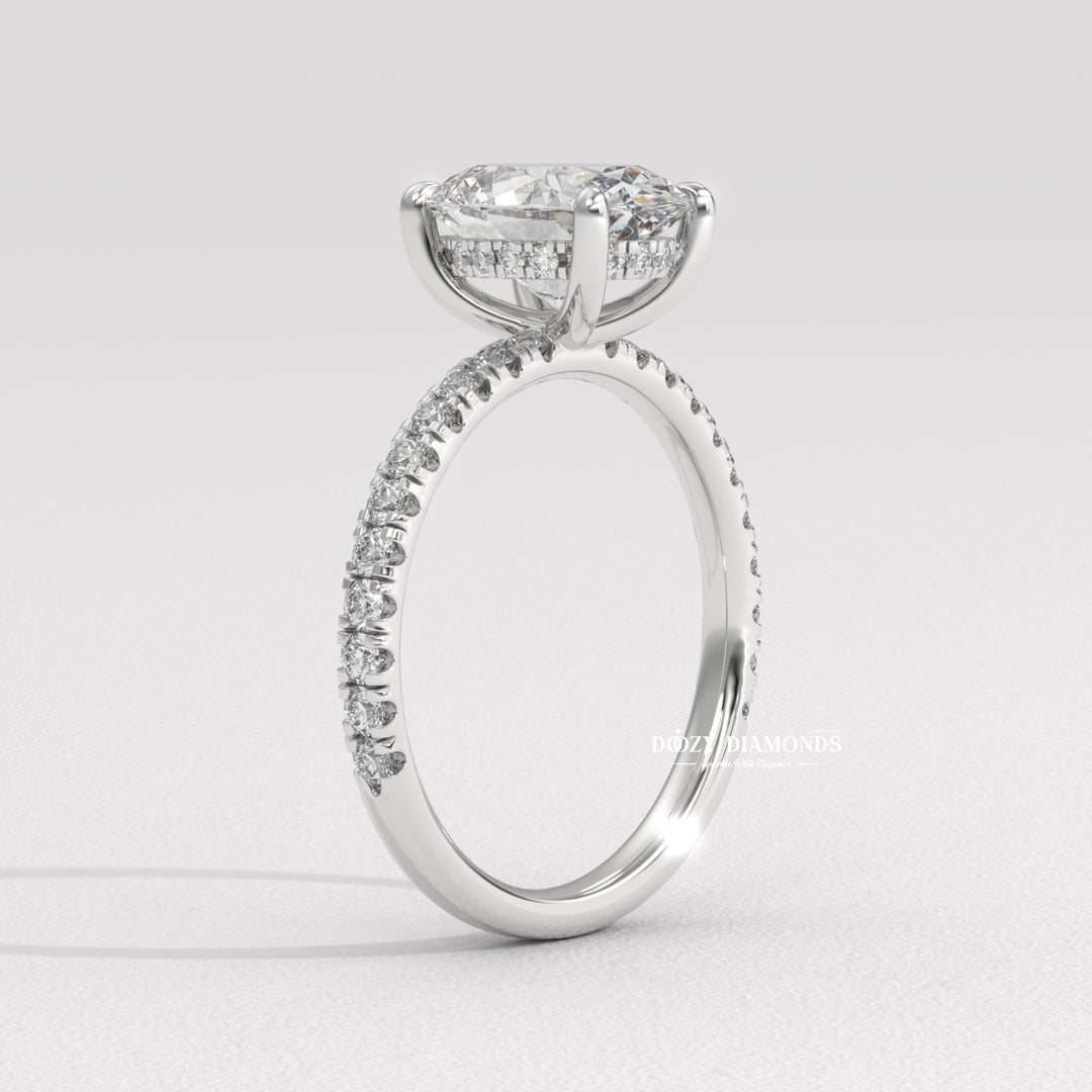 Oval hidden halo diamond ring presented in signature gift packaging