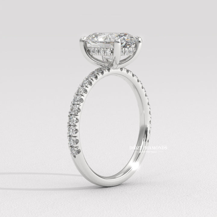 Oval hidden halo diamond ring presented in signature gift packaging