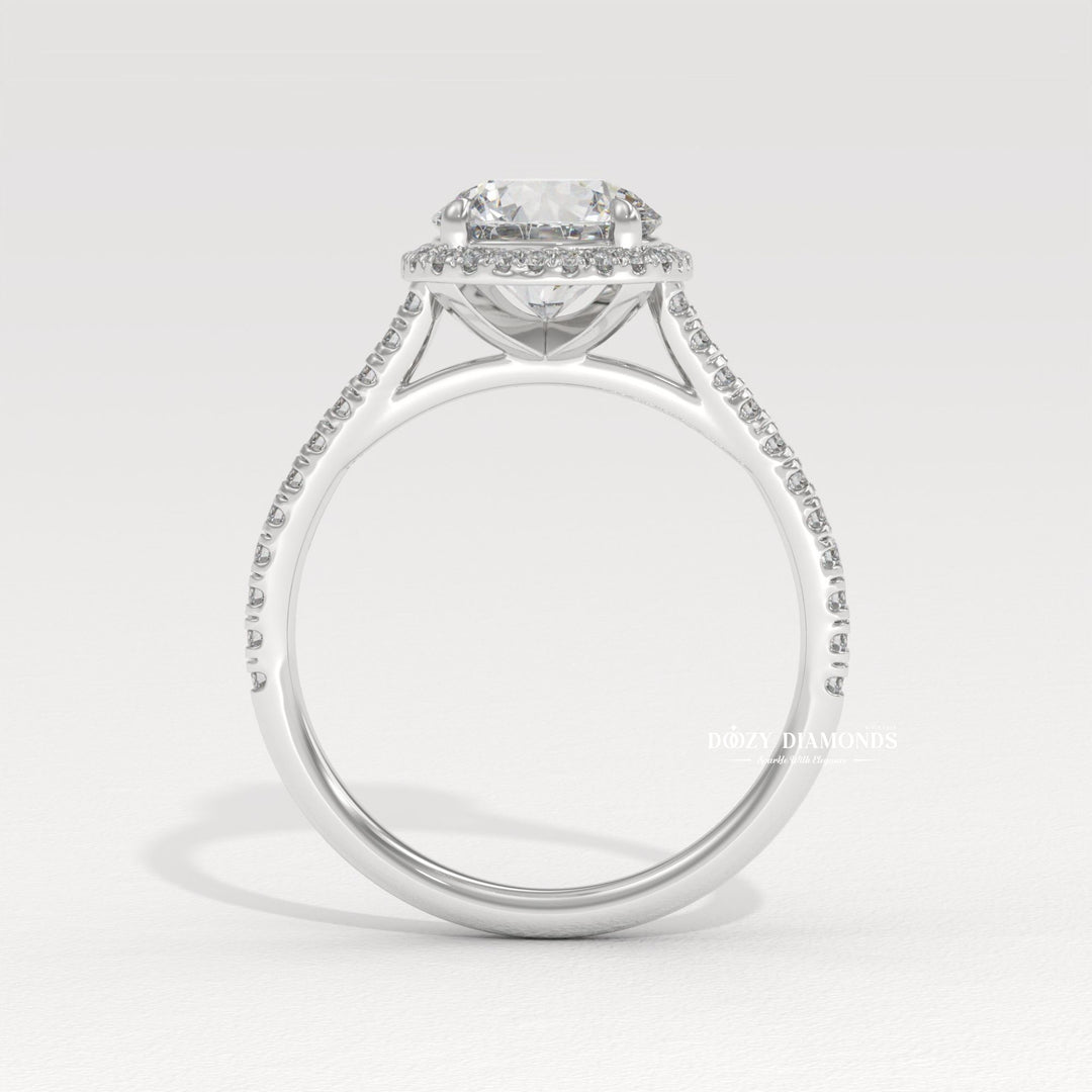Round halo lab grown diamond ring fitted on finger