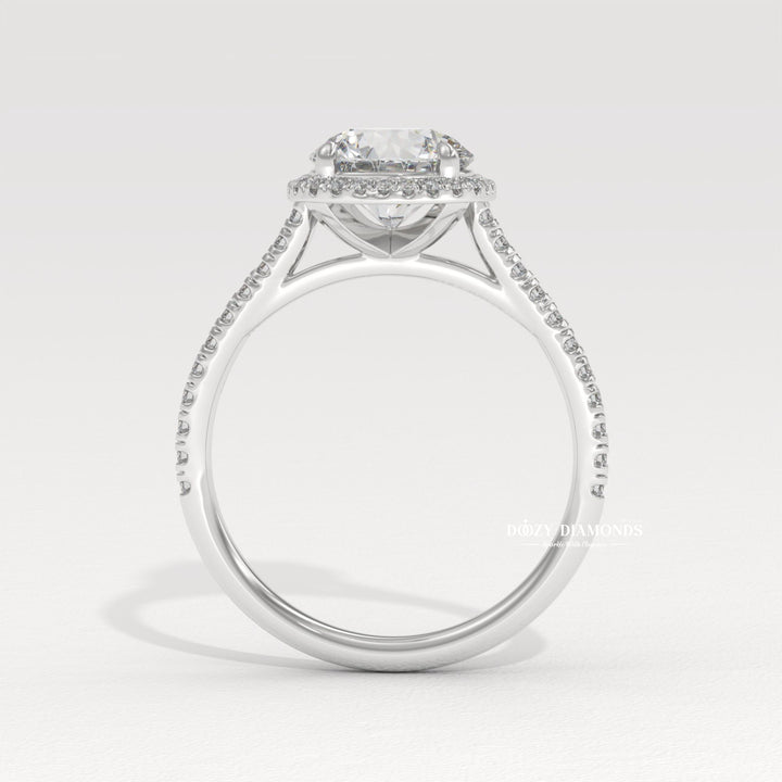 Round halo lab grown diamond ring fitted on finger